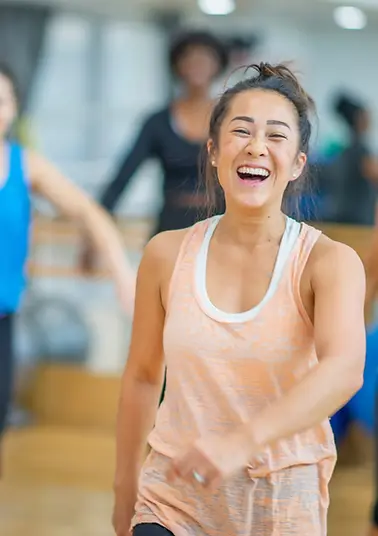 Adults enjoying a disco fitness dance class